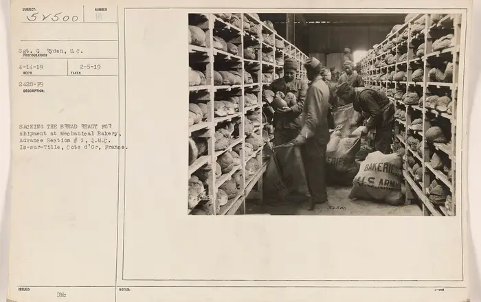 Sacking the bread ready for shipment at Mechanical Bakery, Advance Section 1, Q.M.C. Is sur Tille, Cote d'Or, France   D