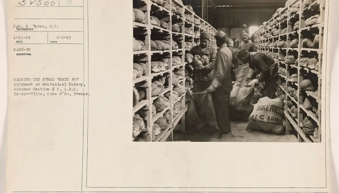 Sacking the bread ready for shipment at Mechanical Bakery, Advance Section 1, Q.M.C. Is sur Tille, Cote d'Or, France D